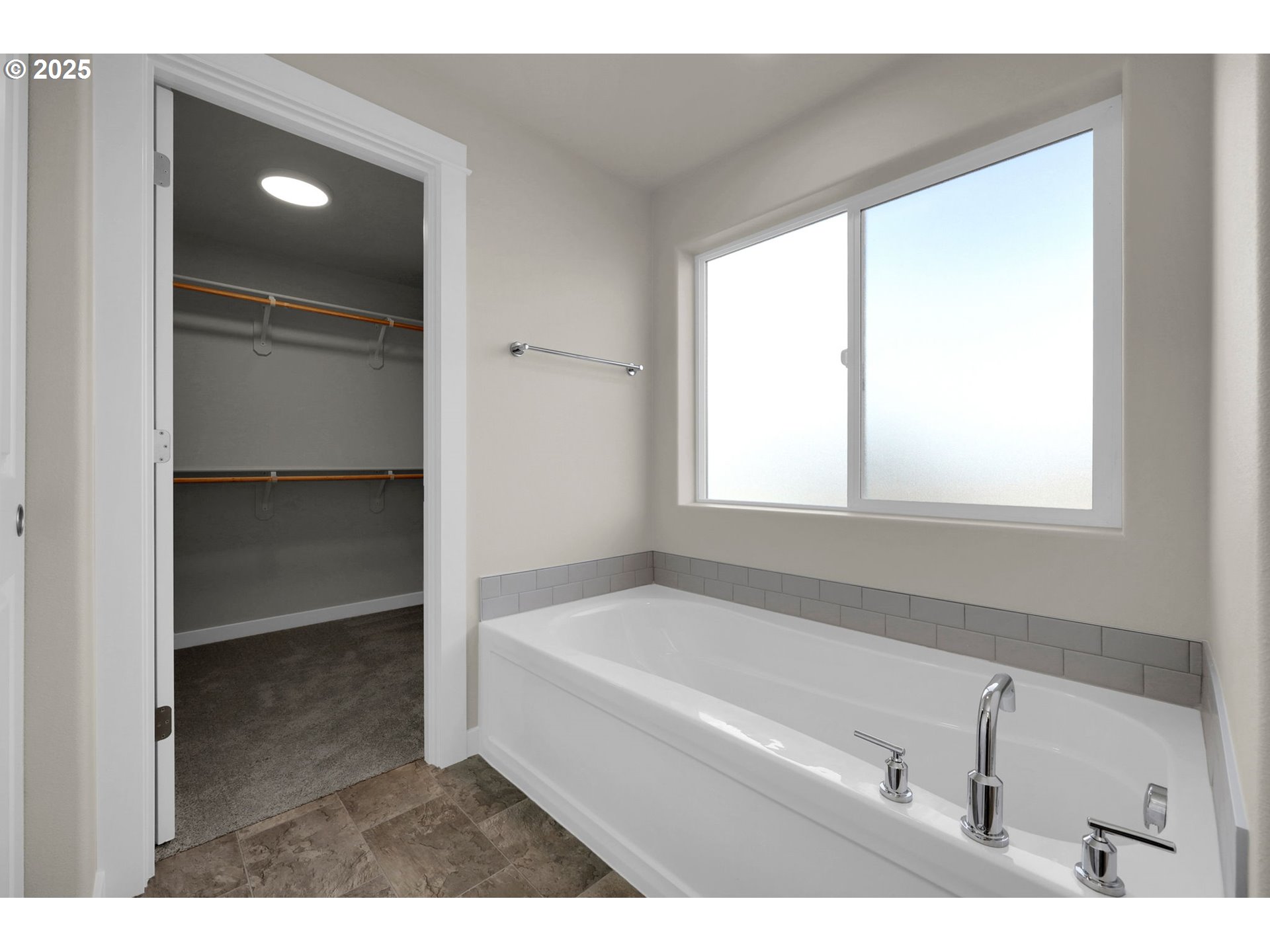 5679 Magnificence Way Eugene, OR 97402 - Photo 35 of 45 a bathroom with a bathtub and a shower