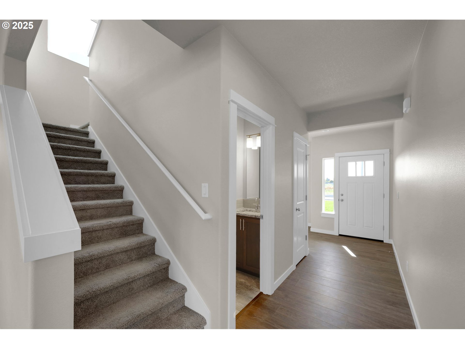 5679 Magnificence Way Eugene, OR 97402 - Photo 7 of 45 a view of an entryway with wooden floor