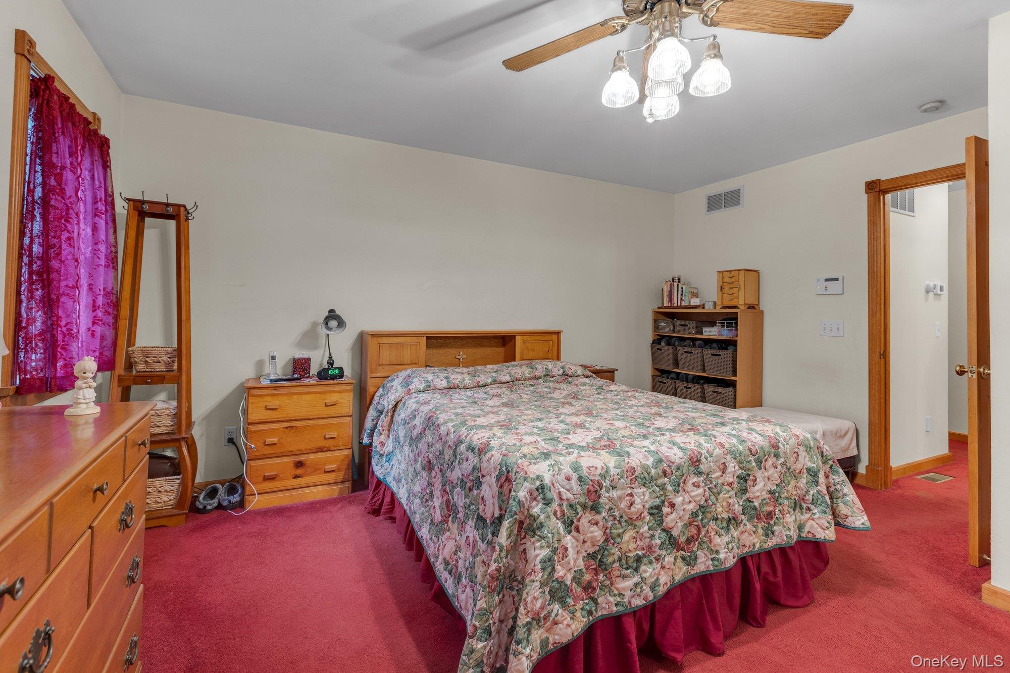 501 Wading River Road Manorville, NY 11949 - Photo 11 of 31 Bedroom featuring carpet and ceiling fan