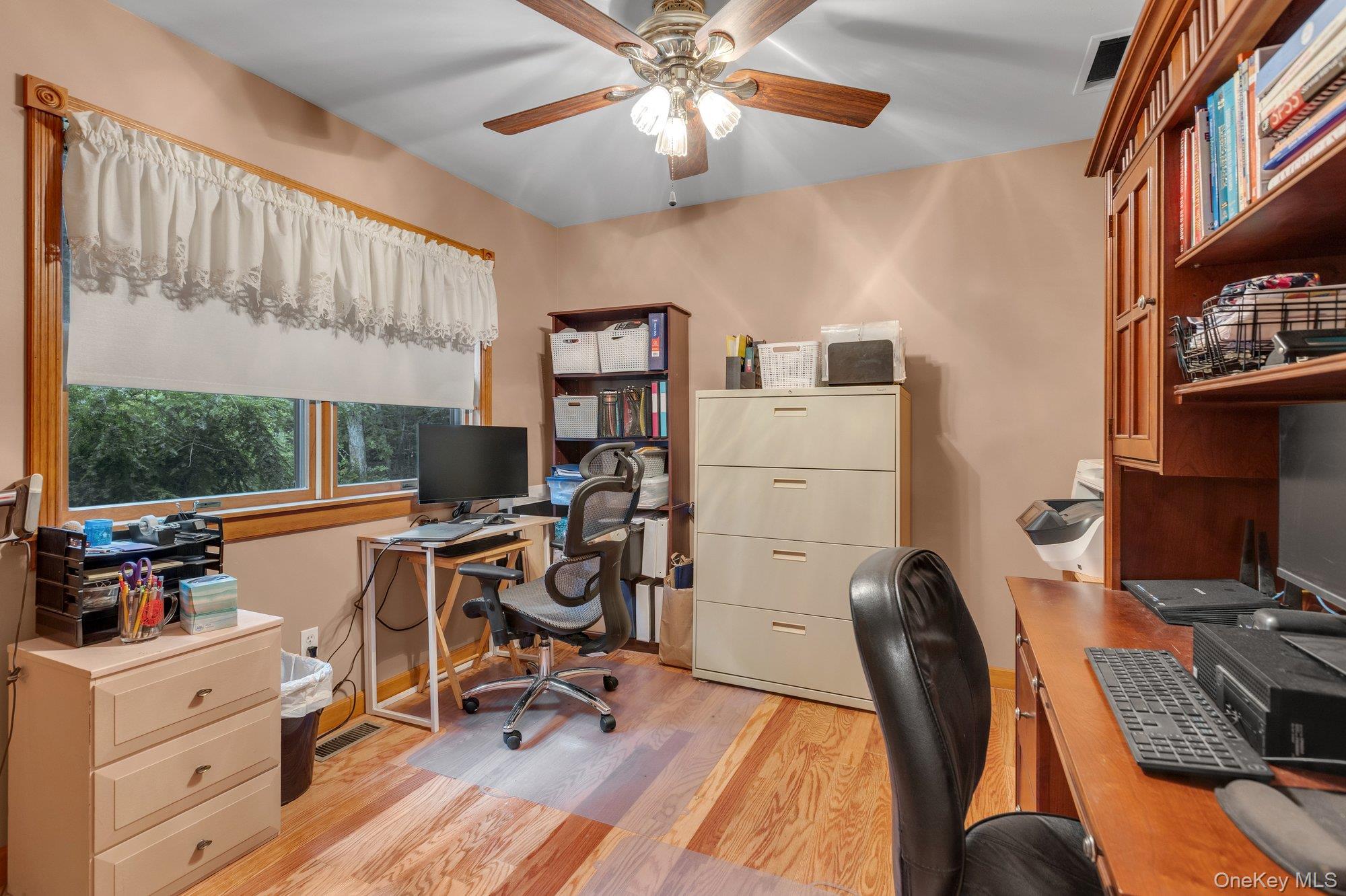 501 Wading River Road Manorville, NY 11949 - Photo 15 of 31 Office featuring light wood-type flooring and a ceiling fan