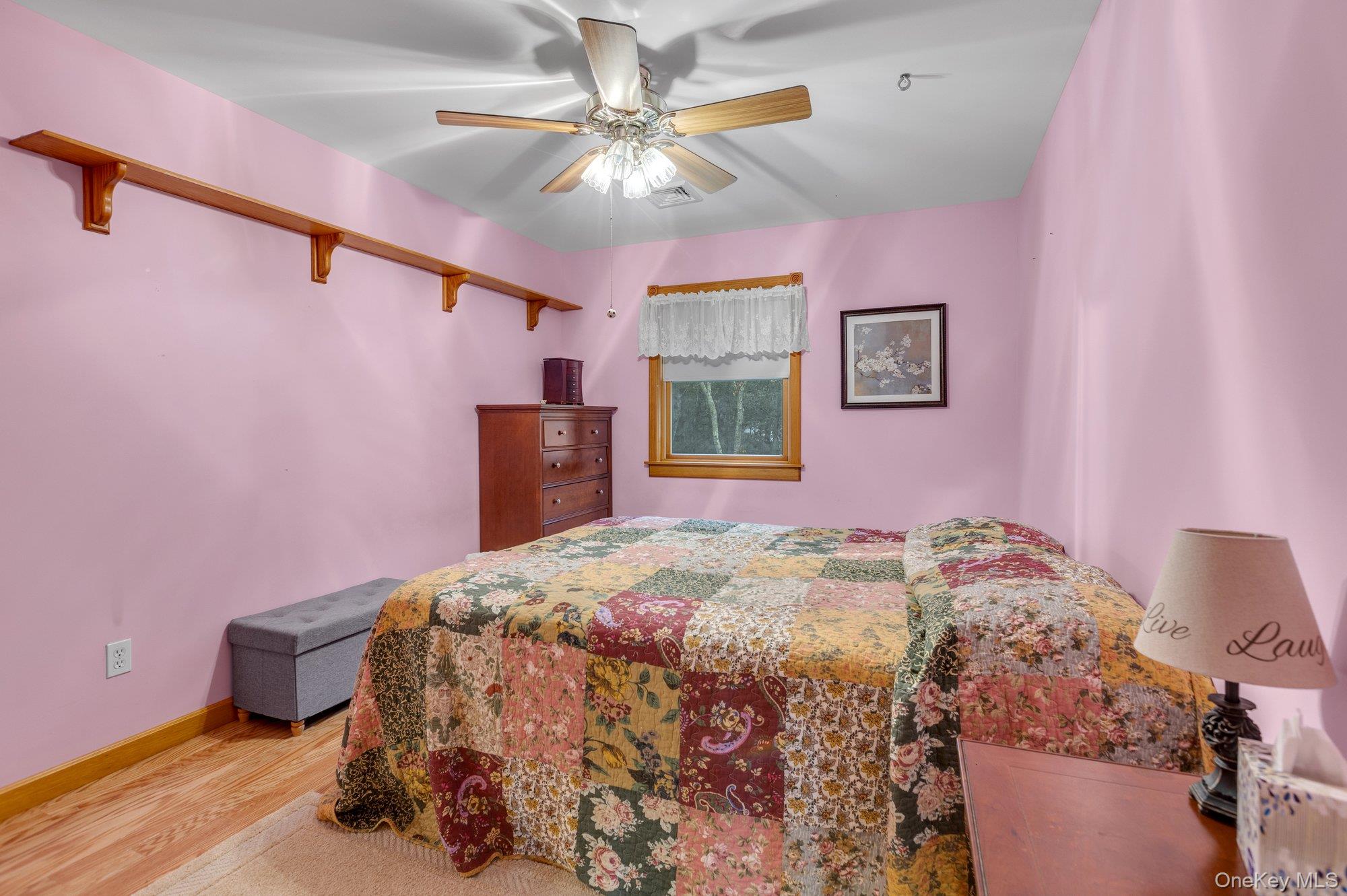 501 Wading River Road Manorville, NY 11949 - Photo 20 of 31 Bedroom featuring light wood-style floors and ceiling fan
