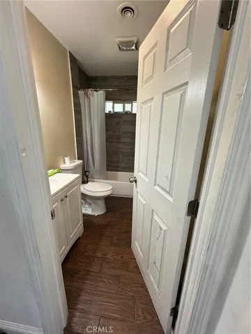a bathroom with a sink a toilet a tub and a shower