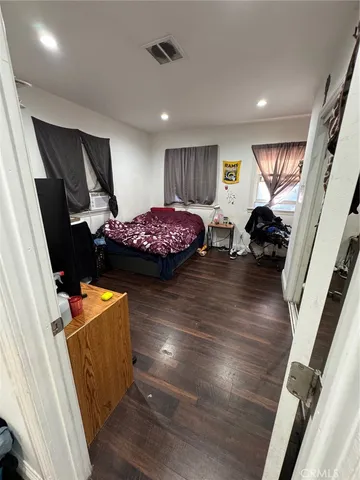 a room with furniture and wooden floor