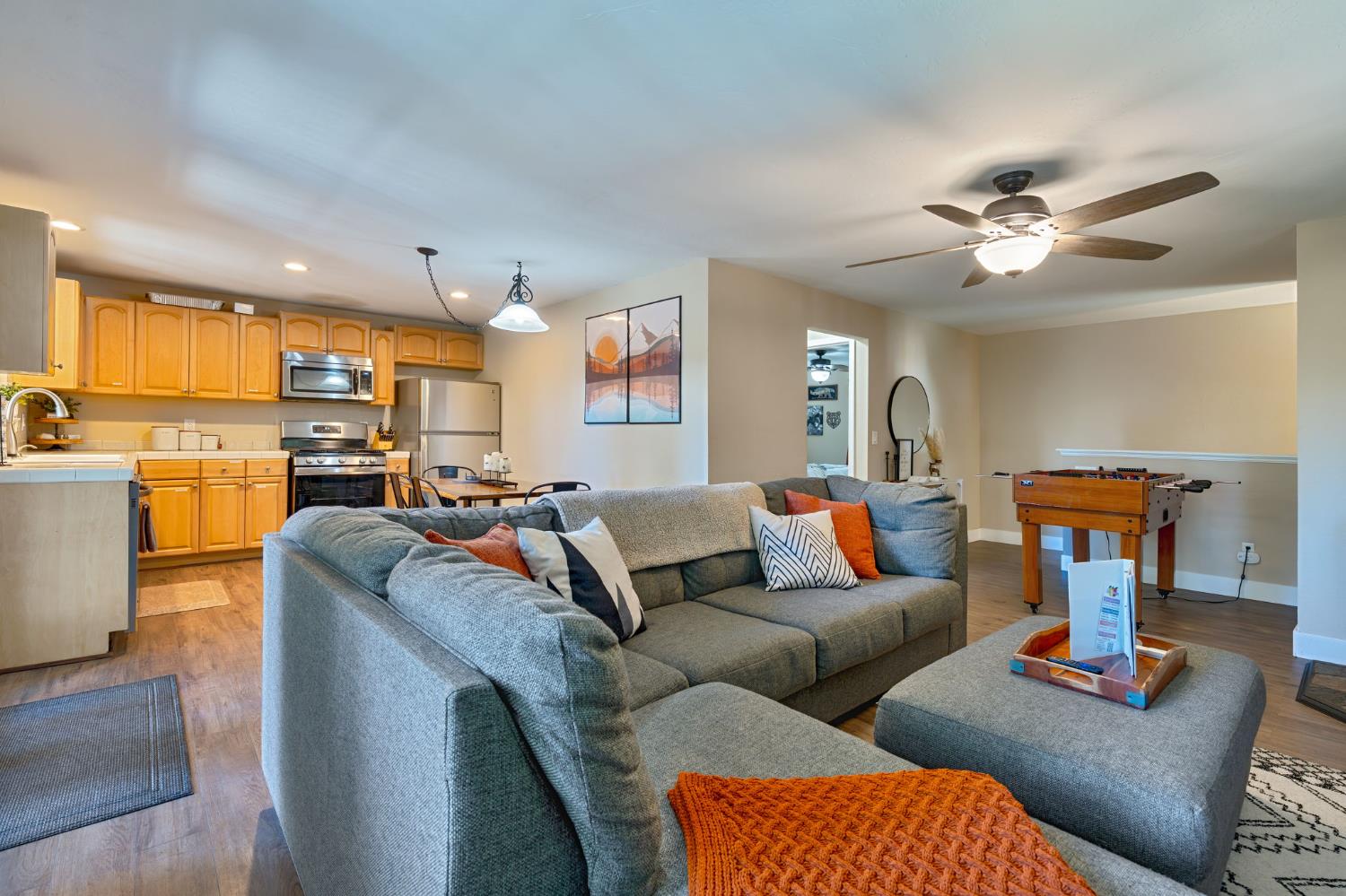 3960 Garnet Road Pollock Pines, CA 95726 - Photo 15 of 50 a living room with furniture a fireplace and kitchen view