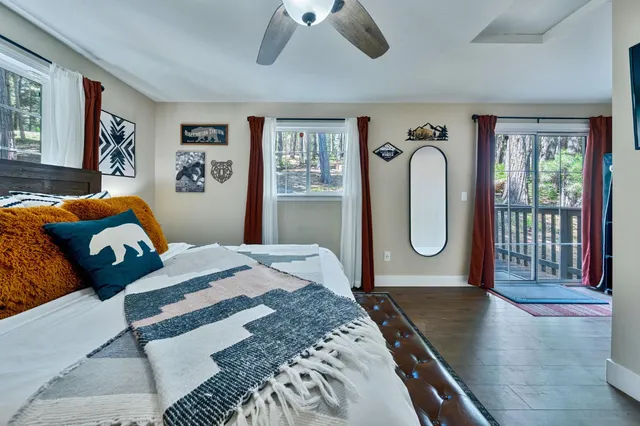 a bedroom with furniture and a window