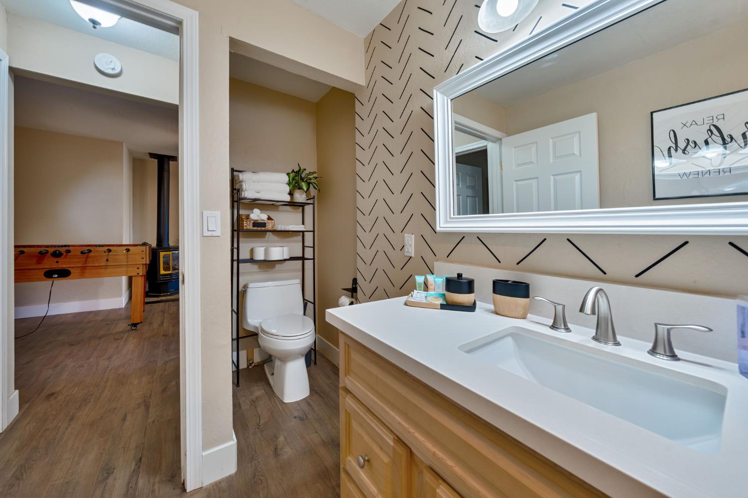 3960 Garnet Road Pollock Pines, CA 95726 - Photo 26 of 50 a bathroom with a sink a toilet and shower