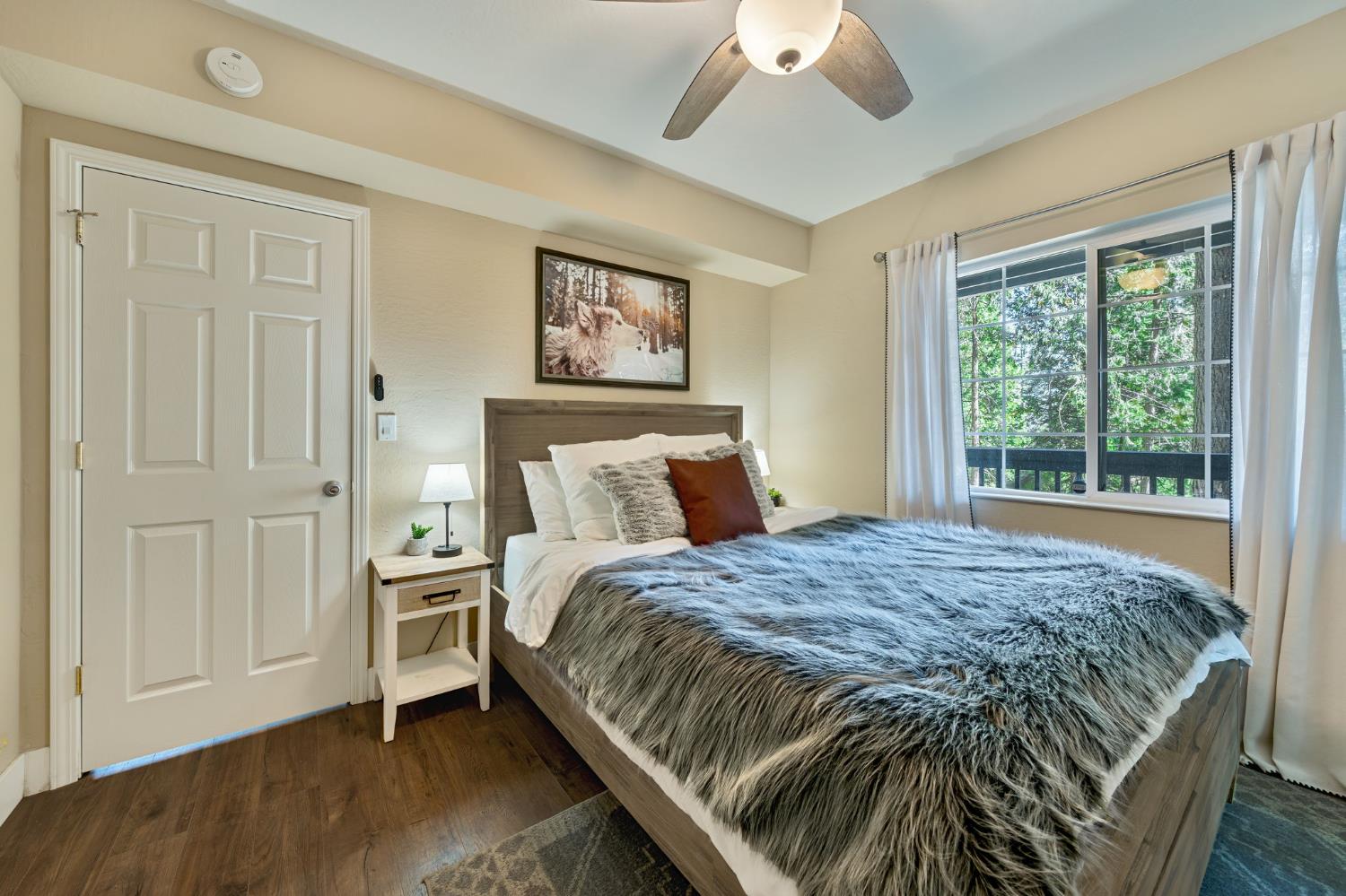 3960 Garnet Road Pollock Pines, CA 95726 - Photo 29 of 50 a bed sitting in a bedroom next to a window