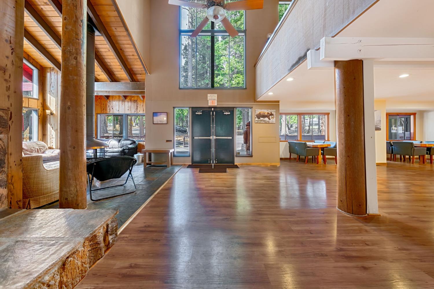 3960 Garnet Road Pollock Pines, CA 95726 - Photo 38 of 50 an empty room with wooden floor and a fireplace