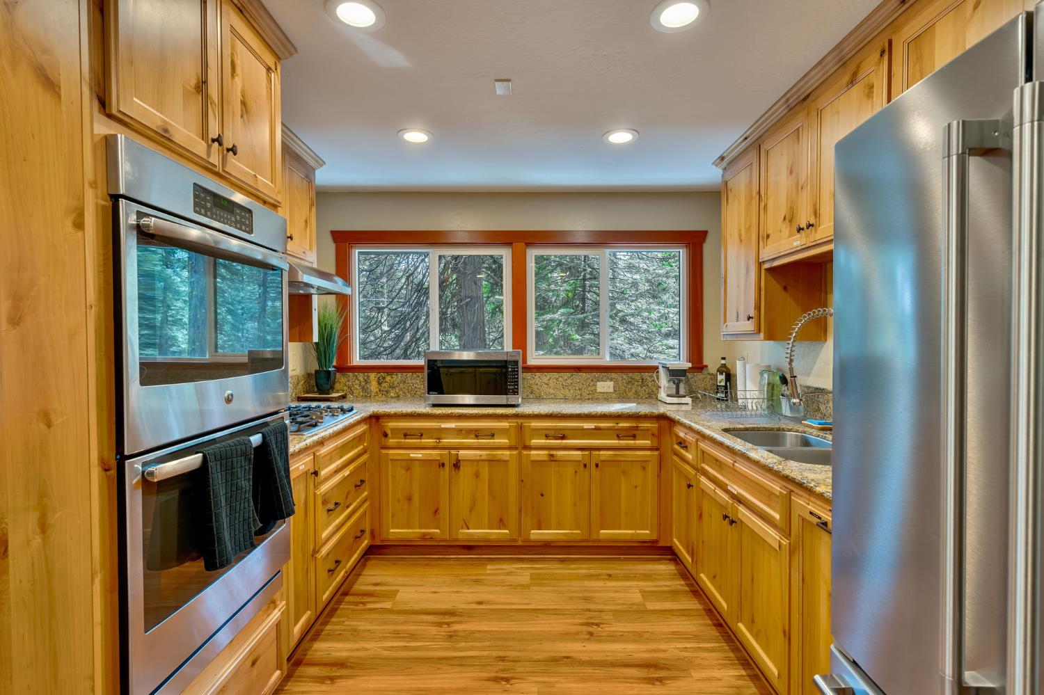 3960 Garnet Road Pollock Pines, CA 95726 - Photo 42 of 50 a view of a kitchen with a sink and large windows