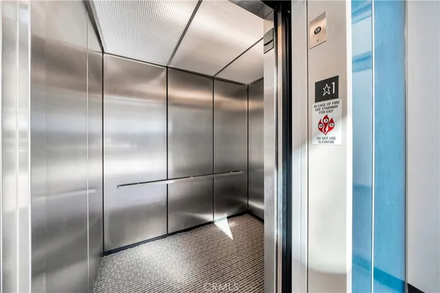 a kitchen with stainless steel appliances and white cabinets