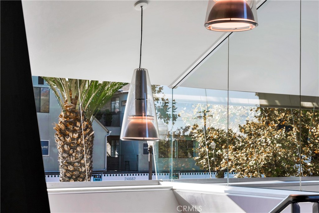 24691 Del Prado Avenue Dana Point, CA 92629 - Photo 26 of 67 a view of a floor to ceiling window and tree