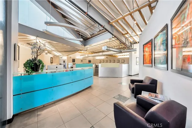 a bedroom with furniture and a flat screen tv