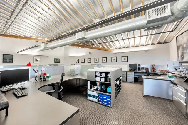 a kitchen with stainless steel appliances a refrigerator sink and microwave