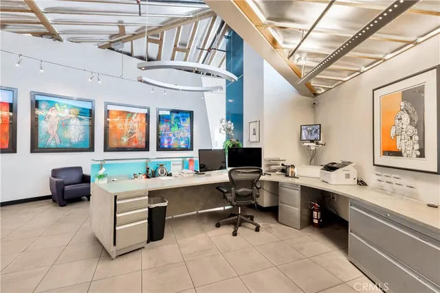a large white kitchen with lots of appliances
