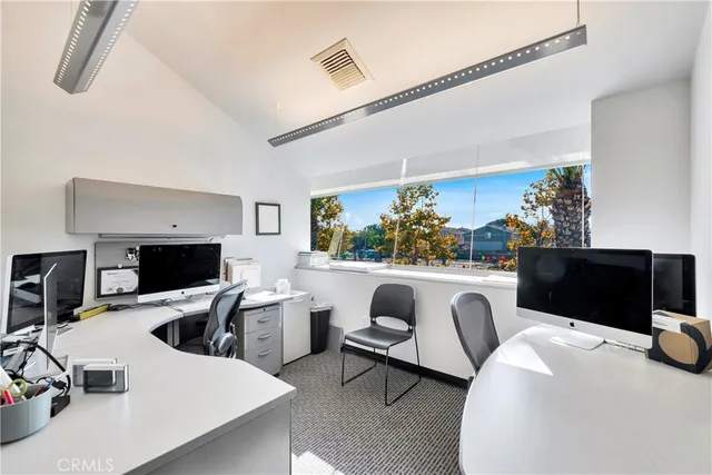 a kitchen with stainless steel appliances a refrigerator sink and cabinets