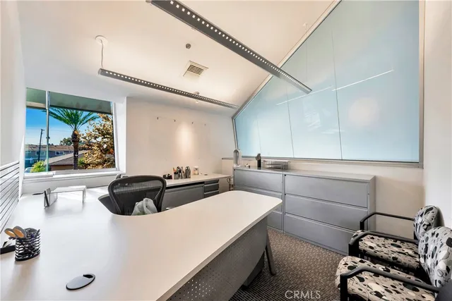 a kitchen that has a sink and a stove in it