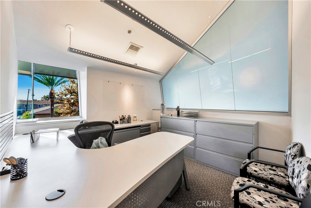 24691 Del Prado Avenue Dana Point, CA 92629 - Photo 49 of 67 a living room with furniture and a large window