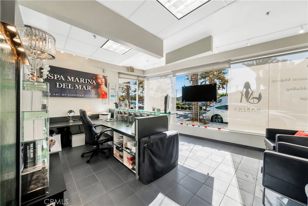 24691 Del Prado Avenue Dana Point, CA 92629 - Photo 63 of 67 a view of a livingroom with furniture and a flat screen tv