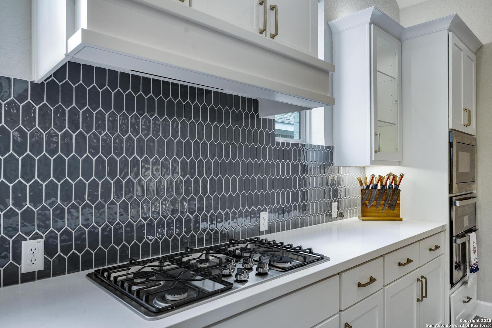 10027 Sarah Place Boerne, TX 78006 - Photo 12 of 47 a kitchen with stove and cabinets