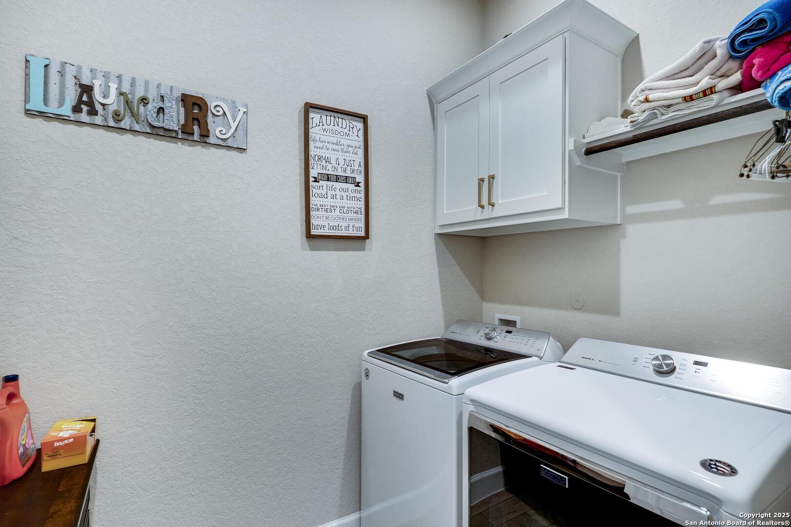 10027 Sarah Place Boerne, TX 78006 - Photo 17 of 47 a utility room with dryer and washer