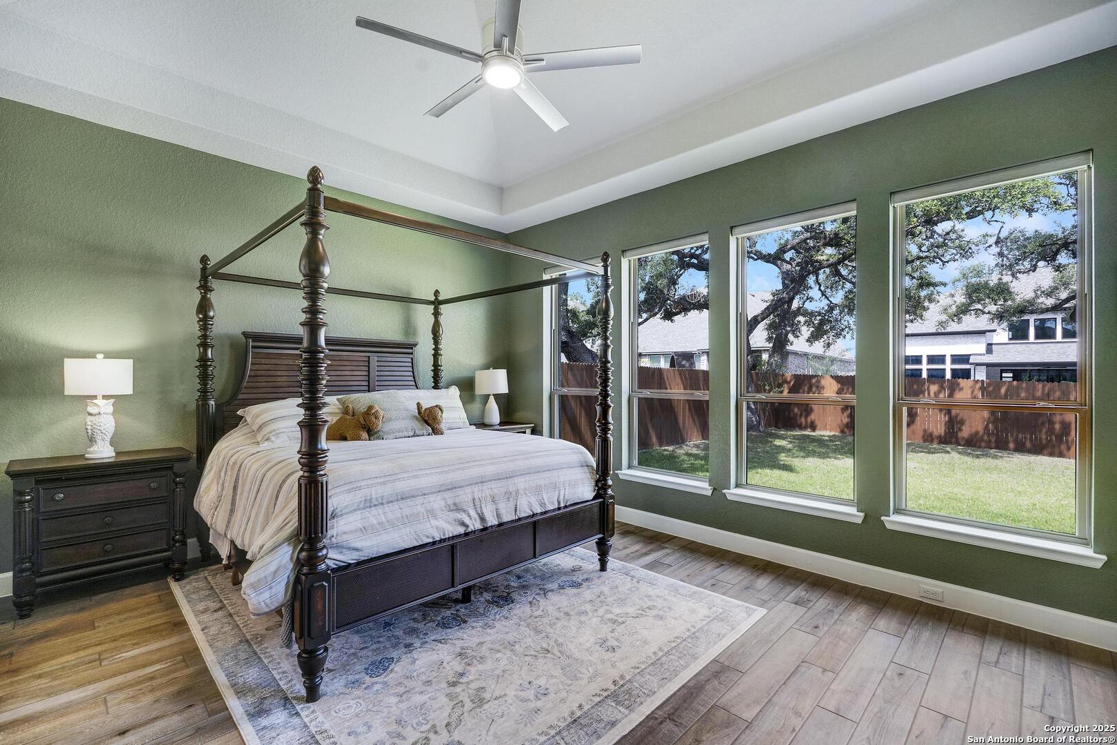 10027 Sarah Place Boerne, TX 78006 - Photo 18 of 47 a bed sitting in a bedroom next to a window