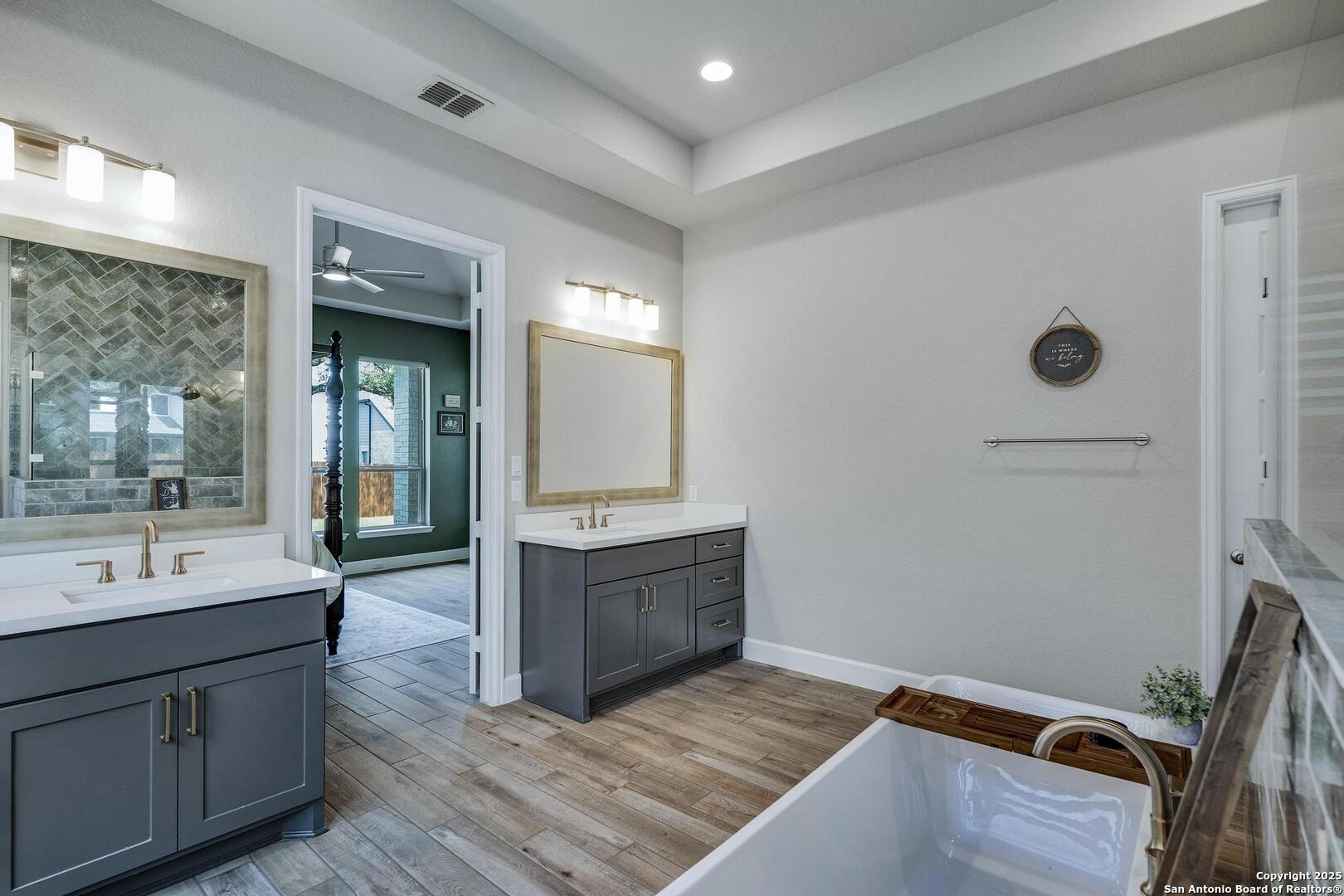 10027 Sarah Place Boerne, TX 78006 - Photo 23 of 47 a bathroom with a sink and a mirror