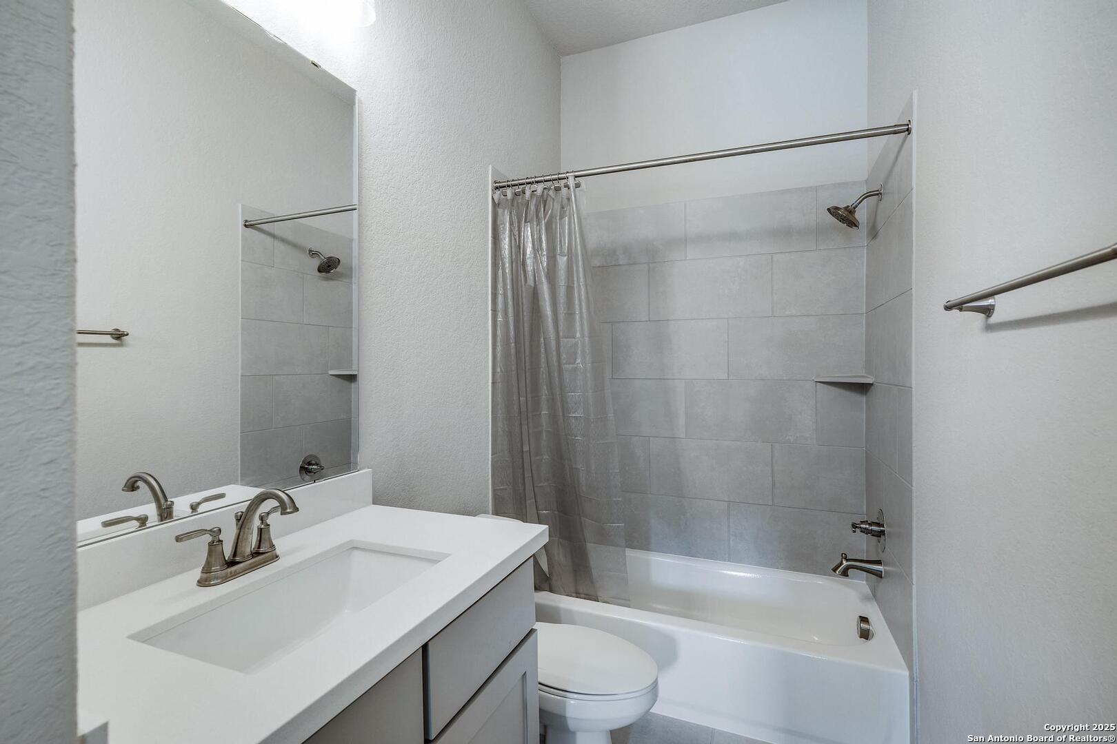 10027 Sarah Place Boerne, TX 78006 - Photo 27 of 47 a bathroom with a sink toilet and shower
