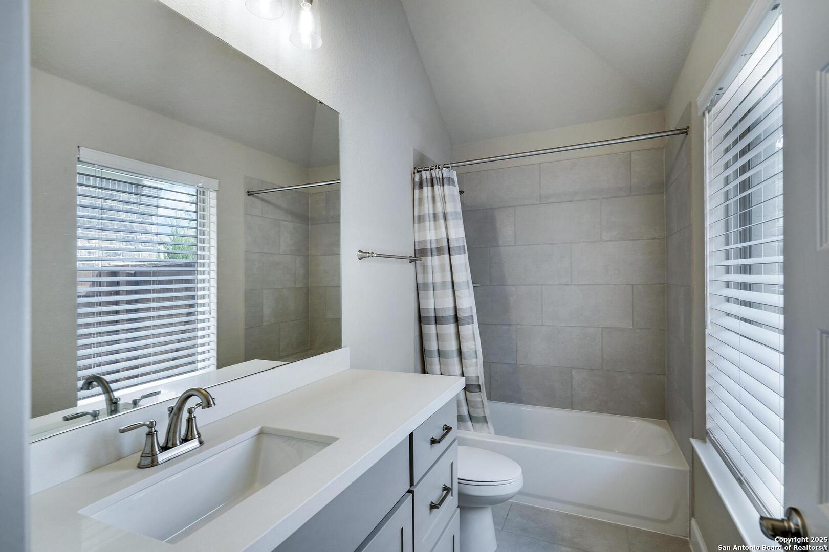 10027 Sarah Place Boerne, TX 78006 - Photo 29 of 47 a bathroom with a sink toilet and shower