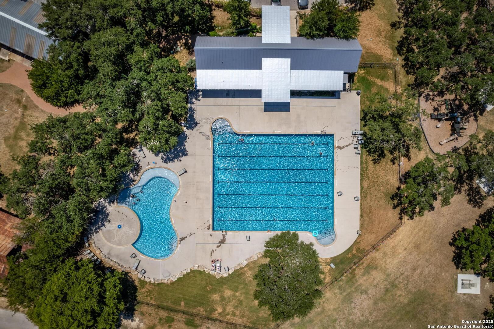 10027 Sarah Place Boerne, TX 78006 - Photo 37 of 47 an aerial view of a house with garden space and wooden fence