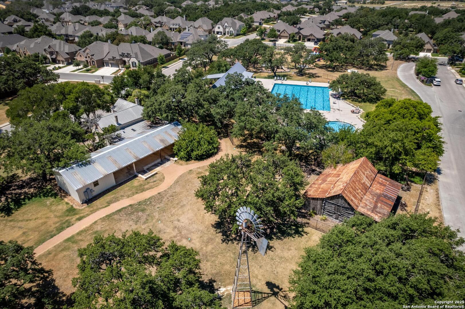 10027 Sarah Place Boerne, TX 78006 - Photo 39 of 47 an aerial view of a house with a yard and lake view