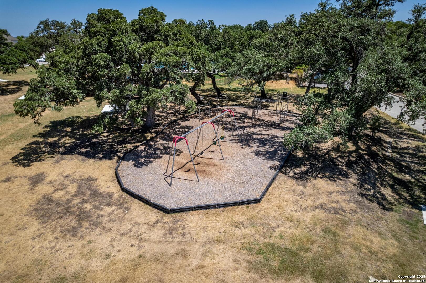 10027 Sarah Place Boerne, TX 78006 - Photo 40 of 47 a view of a wooden floor with a tree