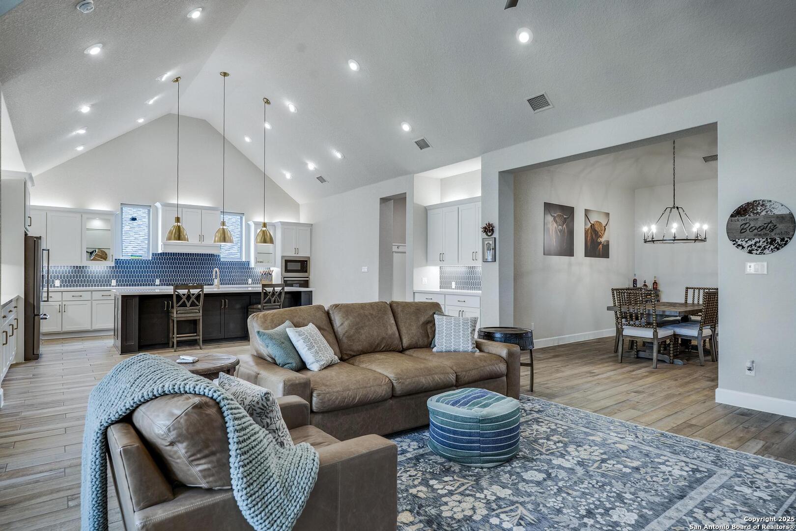 10027 Sarah Place Boerne, TX 78006 - Photo 6 of 47 a living room with furniture kitchen view and a table
