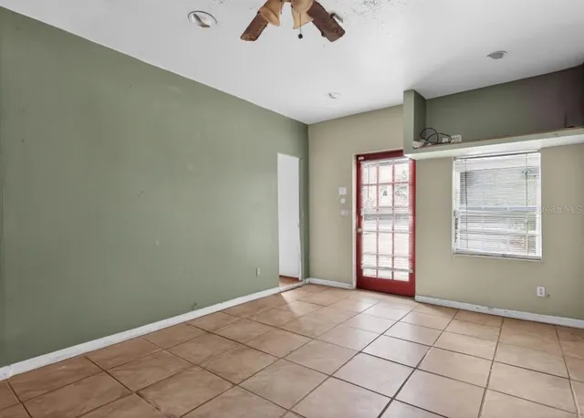 a view of an empty room with a window