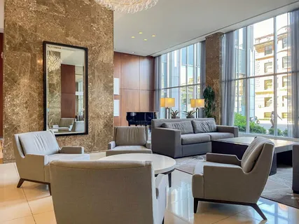 a living room with furniture and a large window