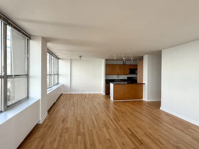 a view of kitchen with sink and wooden floor