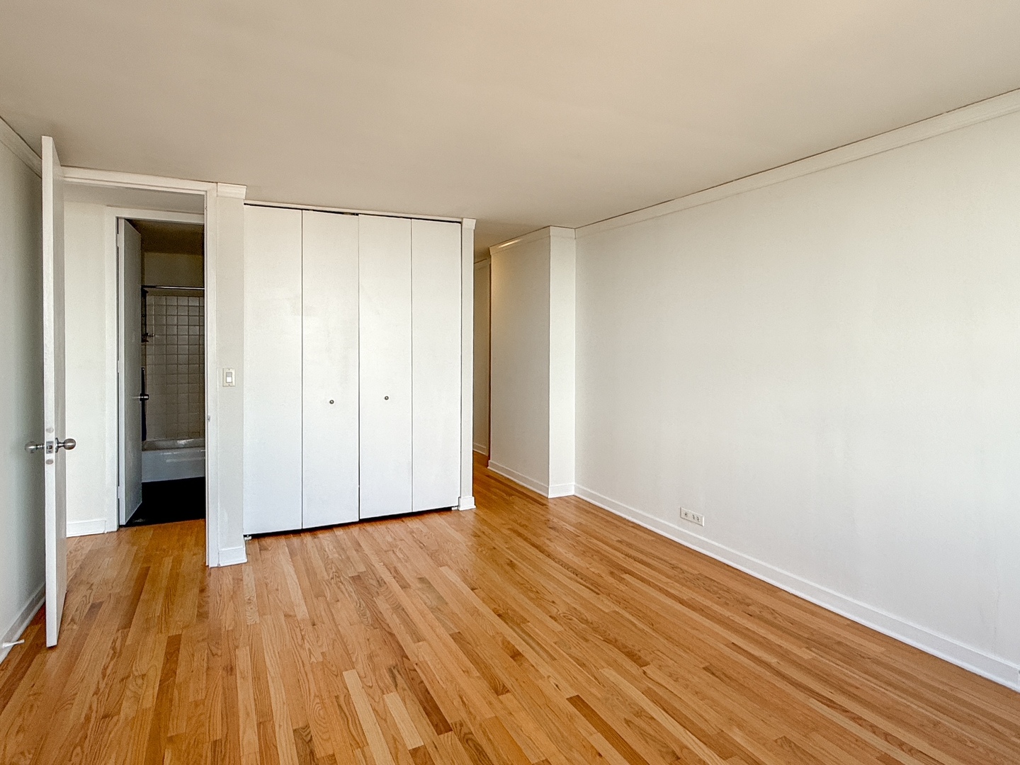 655 West Irving Park Road, Unit 4702 Chicago, IL 60613 - Photo 8 of 17 a view of an empty room with wooden floor