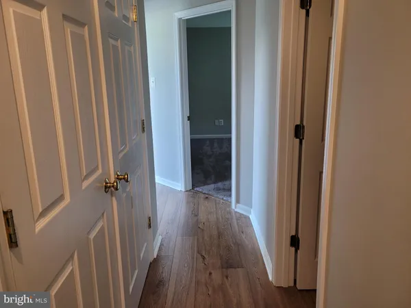 a bathroom with a sink a toilet and shower curtain