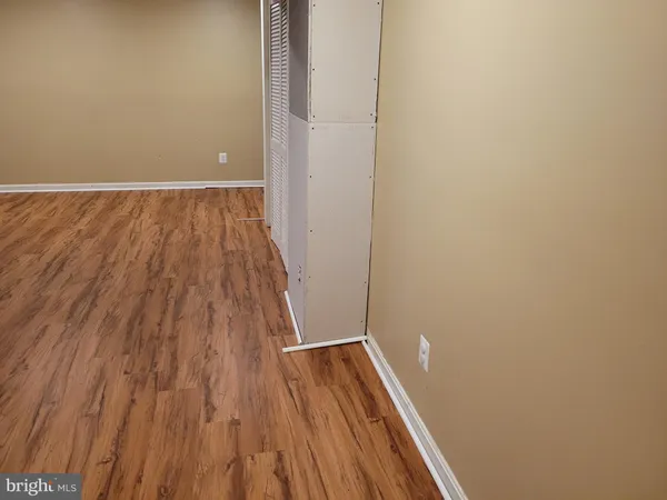 a view of wooden floor in a bedroom