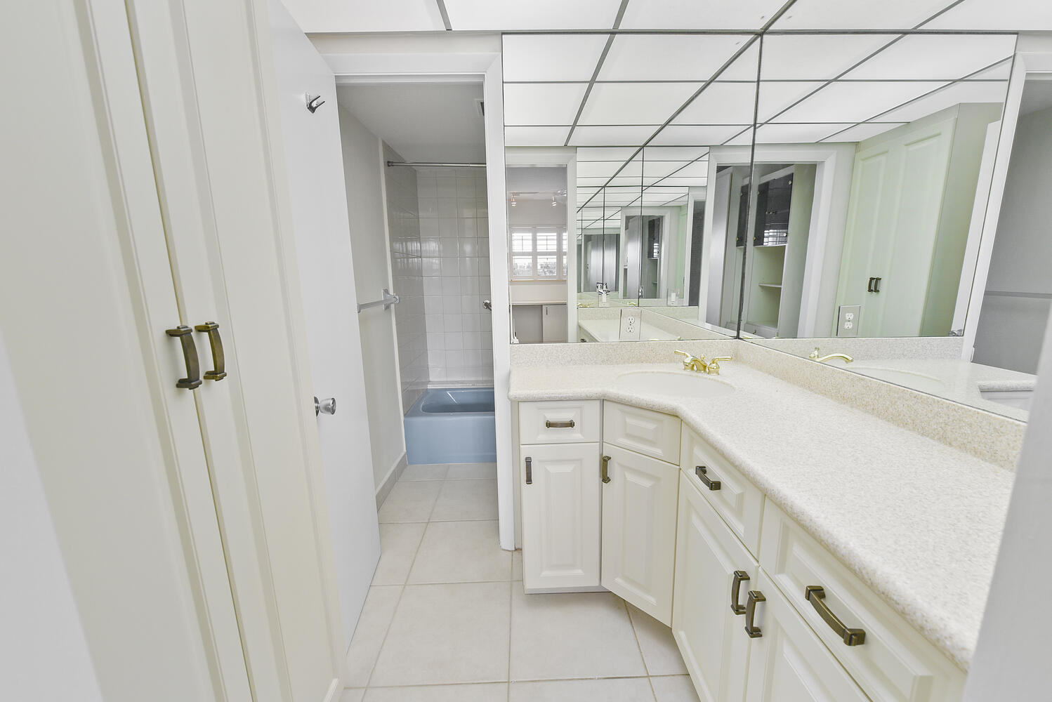 2871 North Ocean Boulevard, Unit F429 Boca Raton, FL 33431 - Photo 15 of 38 a spacious bathroom with a double vanity sink a mirror and a shower