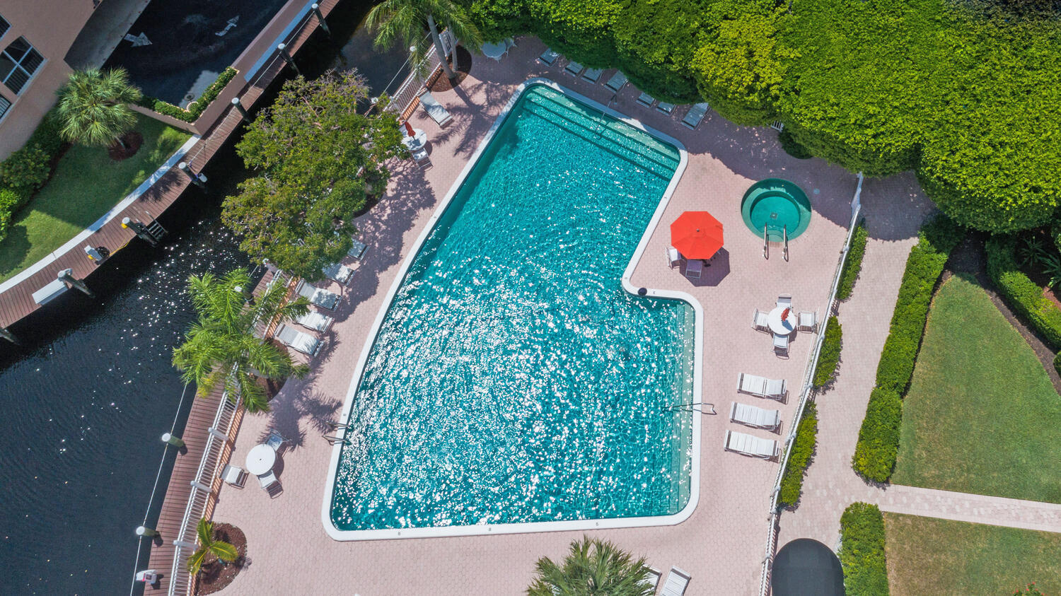 2871 North Ocean Boulevard, Unit F429 Boca Raton, FL 33431 - Photo 28 of 38 an aerial view of swimming pool patio and outdoor seating