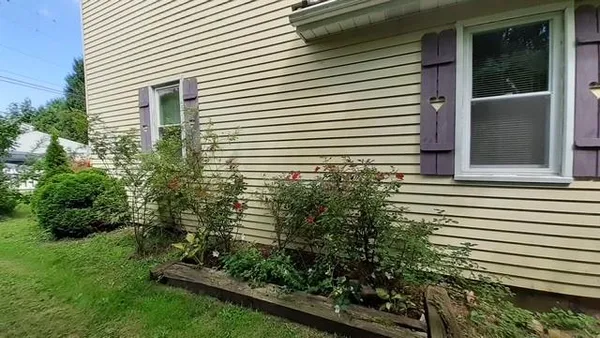 a view of a house with a yard