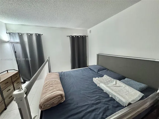 a bedroom with a bed and furniture