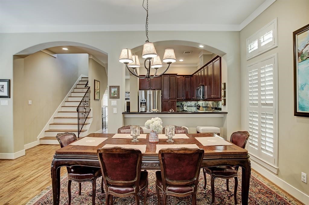 246 Detering Street Houston, TX 77007 - Photo 11 of 27 a view of a dining room with furniture and wooden floor
