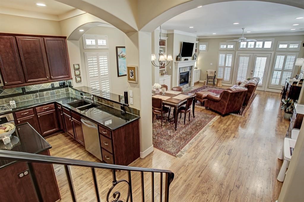 246 Detering Street Houston, TX 77007 - Photo 14 of 27 a living room with furniture a large window and wooden floors