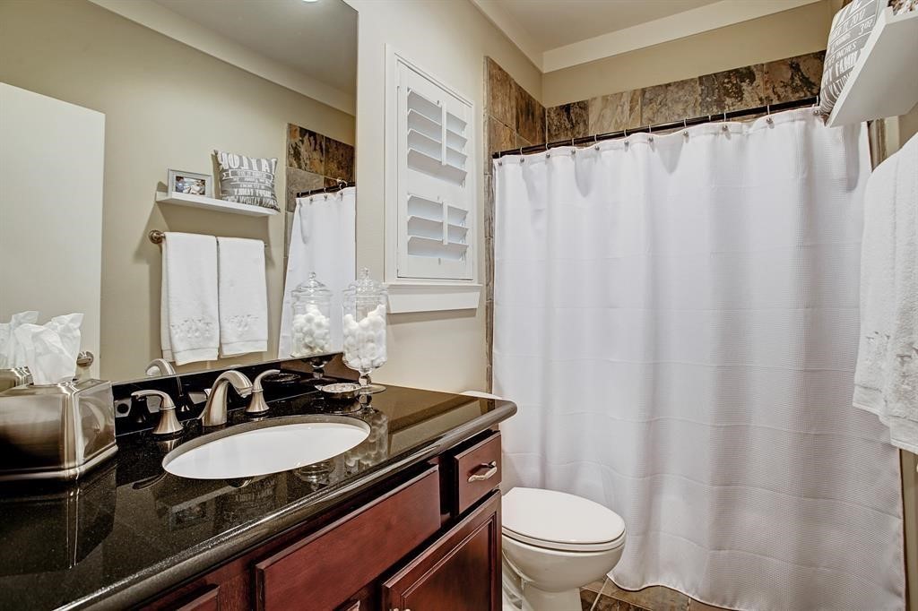 246 Detering Street Houston, TX 77007 - Photo 16 of 27 a bathroom with a sink and a mirror
