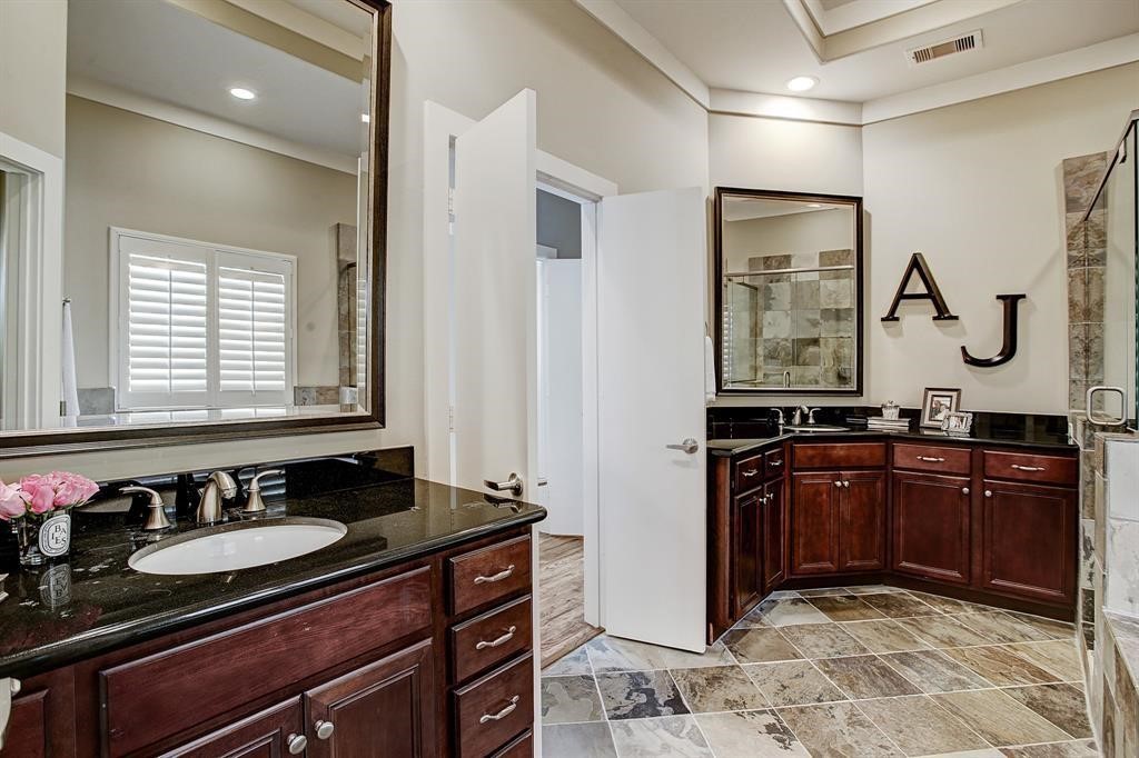 246 Detering Street Houston, TX 77007 - Photo 18 of 27 a bathroom with a granite countertop sink and a mirror