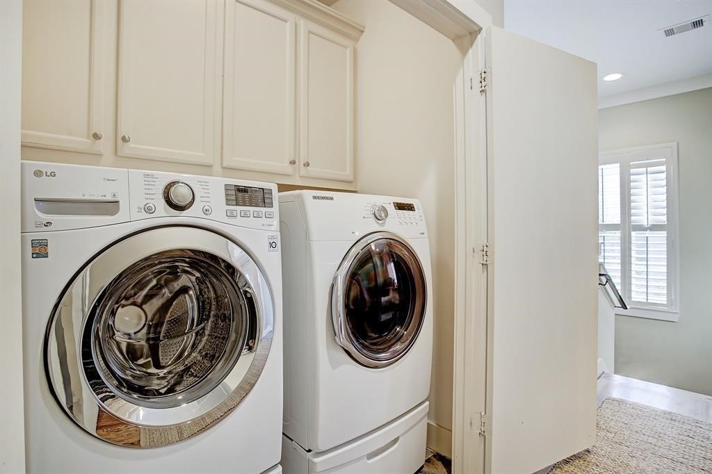 246 Detering Street Houston, TX 77007 - Photo 22 of 27 a utility room with dryer and washer