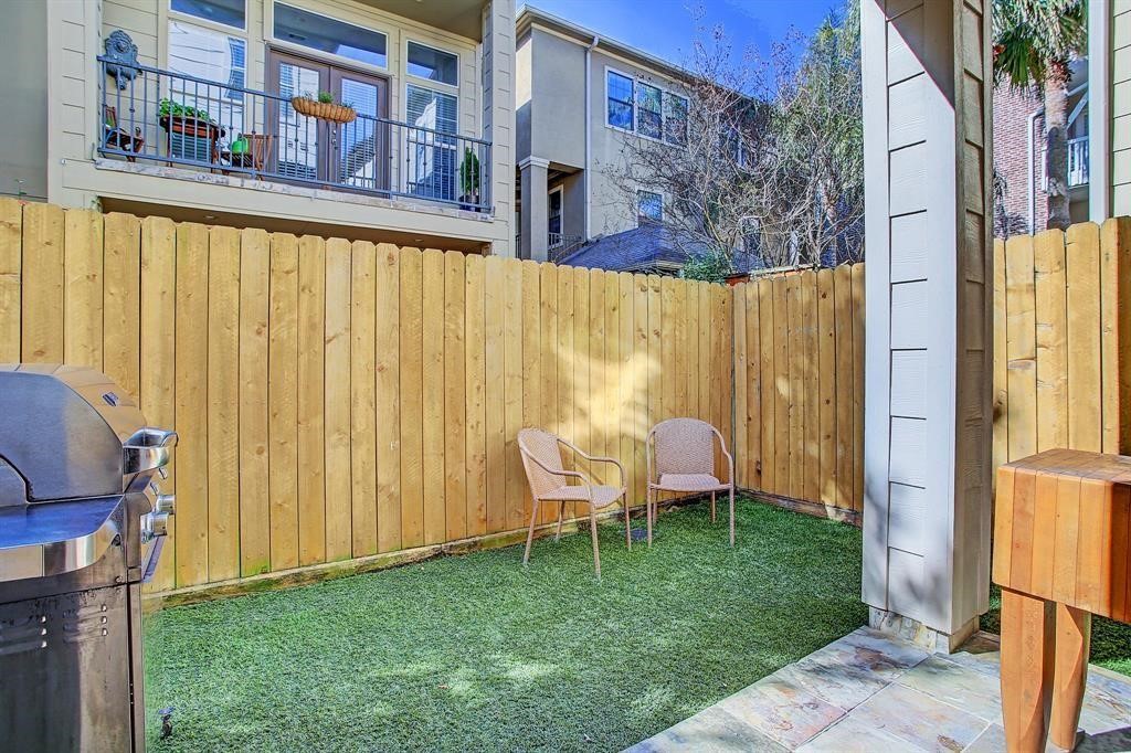 246 Detering Street Houston, TX 77007 - Photo 24 of 27 a backyard of a house with outdoor seating