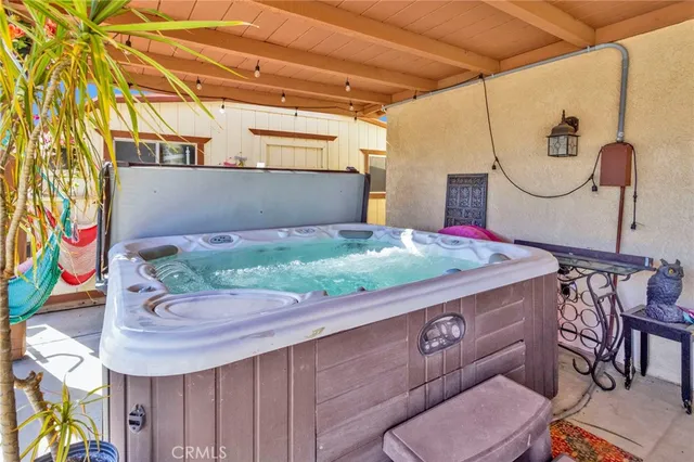 a backyard of a house with a yard and outdoor seating