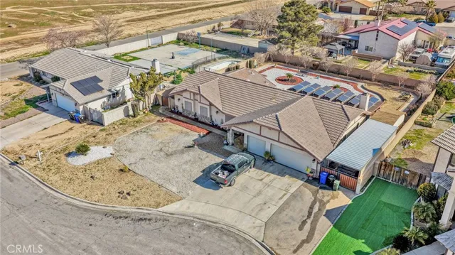 aerial view of a house with a big yard